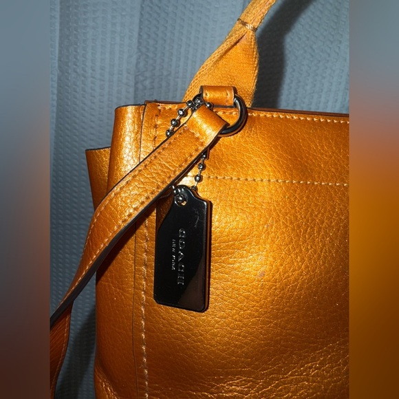 Coach Metallic Derby Backpack in tangerine orange pebbled leather